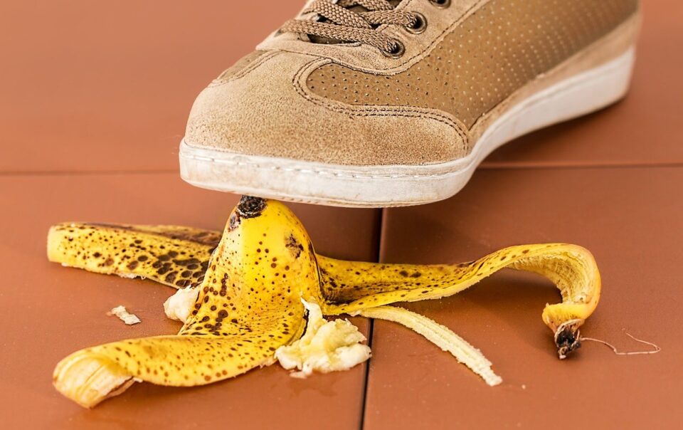 sneaker and banana peel slip and fall image