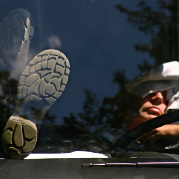 truck driver sleeping in cab of truck