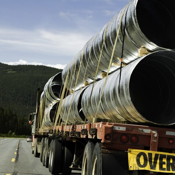 Truck overloaded with pipes