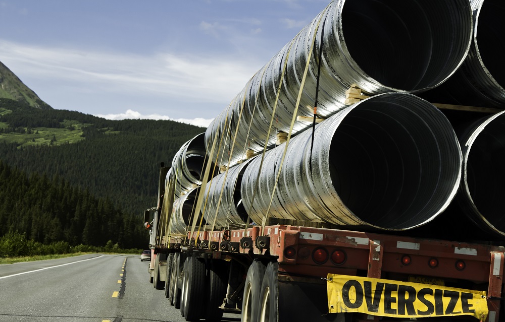 Truck overloaded with pipes