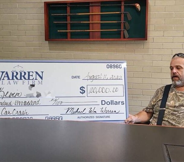 man getting settlement check