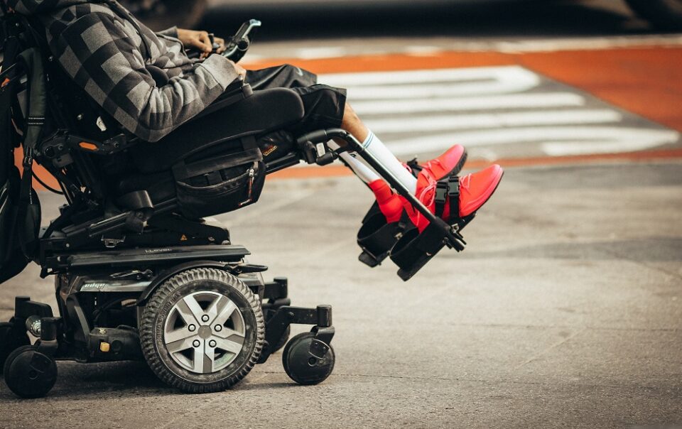 man reclining in a wheelchair neck down