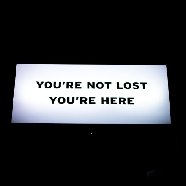 sign reading You're not lost You're here.