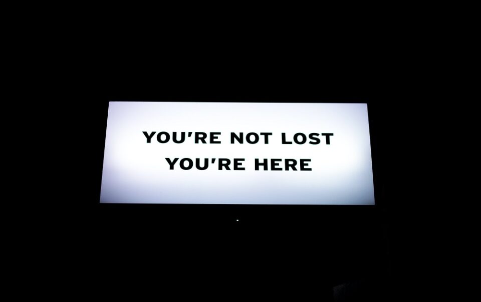 sign reading You're not lost You're here.