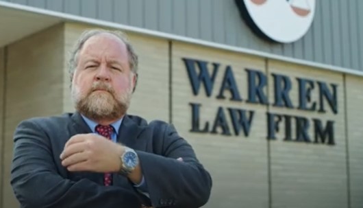 chillicothe attorney Mike Warren in front of his law firm